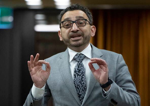 February 14, 2022, Ottawa, ON, Canada: Minister of Transport Omar Alghabra rises during Question Period, Monday, February 14, 2022 in Ottawa. Ottawa Canada  - ZUMAc35_ 20220214_zaf_c35_139 Copyright: xAdrianxWyldx