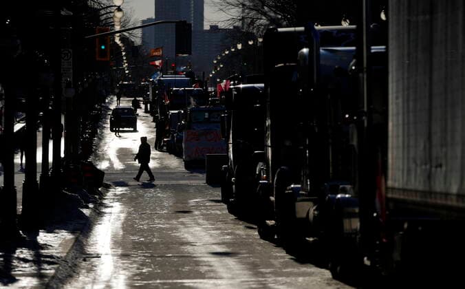 February 14, 2022, Ottawa, ON, CAN: Wellington Street is lined with trucks once again after city officials negotiated to move some trucks towards Parliament and away from downtown residences, on the 18th day of a protest against COVID-19 measures that has grown into a broader anti-government protest, in Ottawa, on Monday, Feb. 14, 2022. Ottawa CAN  - ZUMAc35_ 20220214_zaf_c35_159 Copyright: xJustinxTangx
