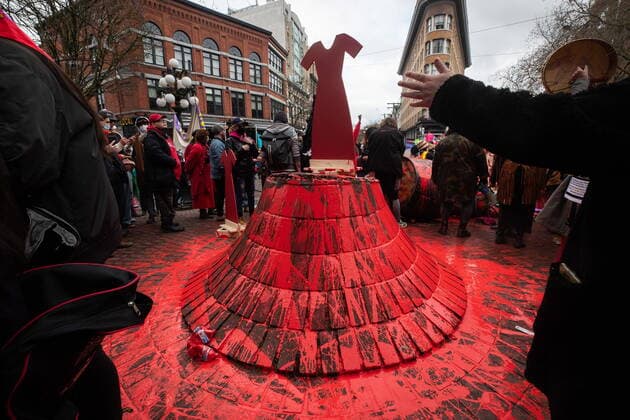 February 14, 2022, VANCOUVER, BC, CANADA: A red dress is placed where the Gassy Jack statue stood after it was toppled and covered in red paint during the annual Women s Memorial March, in Vancouver, on Monday, February 14, 2022. The statue is a monument to Gassy Jack Deighton, a Vancouver saloon owner in the 1860s, whom Vancouver s Gastown neighbourhood is named after. The march is held to honour missing and murdered women and girls from the community with stops along the way to commemorate where women were last seen or found. VANCOUVER CANADA  - ZUMAc35_ 20220214_zaf_c35_160 Copyright: xDarrylxDyckx