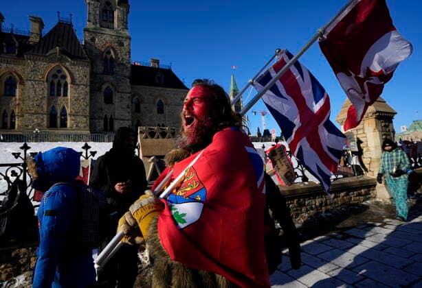 February 14, 2022, Ottawa, ON, CAN: A protester yells öÄufreedomöÄÃ¹ towards a person who attempted to stick a paper sign on a truck criticizing the so called öÄuFreedom Convoy,öÄÃ¹ a protest against COVID-19 measures that has grown into a broader anti-government protest, on its 18th day, in Ottawa, on Monday, Feb. 14, 2022. Ottawa CAN  - ZUMAc35_ 20220214_zaf_c35_166 Copyright: xJustinxTangx