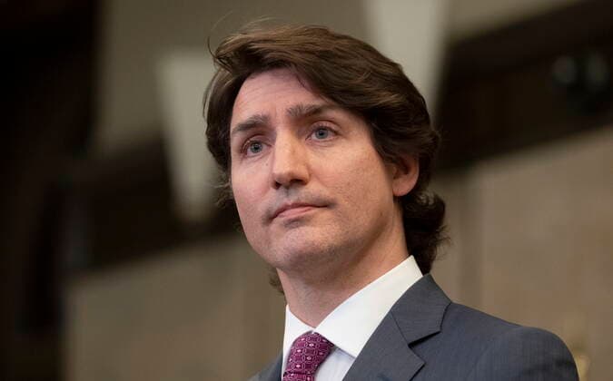 February 14, 2022, Ottawa, ON, Canada: Canadian Prime Minister Justin Trudeau listens to a question from a reporter after announcing the Emergencies Act will be invoked to deal with protests on Monday, February 14, 2022 in Ottawa. Trudeau says he has invoked the Emergencies Act to bring to an end antigovernment blockades he describes as illegal and not about peaceful protest. Ottawa Canada  - ZUMAc35_ 20220214_zaf_c35_190 Copyright: xAdrianxWyldx