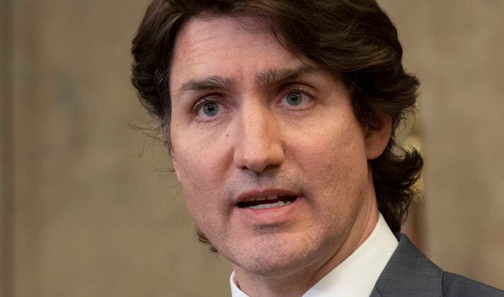 February 14, 2022, Ottawa, ON, Canada: Canadian Prime Minister Justin Trudeau listens to a question from a reporter after announcing the Emergencies Act will be invoked to deal with protests on Monday, February 14, 2022 in Ottawa. Trudeau says he has invoked the Emergencies Act to bring to an end antigovernment blockades he describes as illegal and not about peaceful protest. Ottawa Canada  - ZUMAc35_ 20220214_zaf_c35_191 Copyright: xAdrianxWyldx