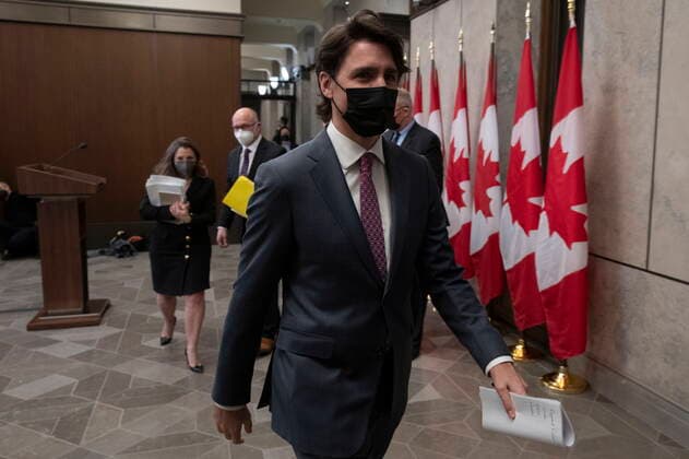 February 14, 2022, Ottawa, ON, Canada: Canadian Prime Minister Justin Trudeau leaves a news conference after announcing the Emergencies Act will be invoked to deal with protests, Monday, February 14, 2022 in Ottawa. Trudeau says he has invoked the Emergencies Act to bring to an end antigovernment blockades he describes as illegal and not about peaceful protest. Ottawa Canada  - ZUMAc35_ 20220214_zaf_c35_194 Copyright: xAdrianxWyldx