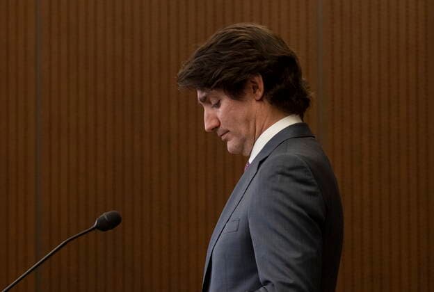 February 14, 2022, Ottawa, ON, Canada: Canadian Prime Minister Justin Trudeau is seen during a news conference where he announced the Emergencies Act will be invoked to deal with protests, Monday, February 14, 2022 in Ottawa. Trudeau says he has invoked the Emergencies Act to bring to an end antigovernment blockades he describes as illegal and not about peaceful protest. Ottawa Canada  - ZUMAc35_ 20220214_zaf_c35_202 Copyright: xAdrianxWyldx