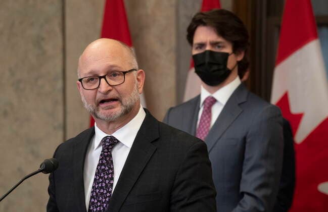 February 14, 2022, Ottawa, ON, Canada: Canadian Prime Minister Justin Trudeau looks on as Minister of Justice and Attorney General of Canada David Lametti speaks following the announcement the Emergencies Act will be invoked to deal with antigovernment blockades, Monday, February 14, 2022 in Ottawa. Ottawa Canada  - ZUMAc35_ 20220214_zaf_c35_211 Copyright: xAdrianxWyldx
