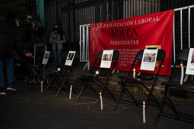 February 14, 2022, Mexico, Mexico: Lit candles are placed next to the pictures of the five journalists who have been murdered in Mexico in 2022..Dozens of journalists came together to protest outside the offices of the Ministry of Interior in Mexico City. It was part of a simultaneous national protest that took place across Mexico following the murder of the fifth journalist in 2022. Mexico Mexico - ZUMAs197 20220214_zaa_s197_408 Copyright: xLexiexHarrison-Crippsx