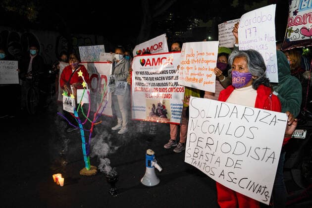 February 14, 2022, Mexico, Mexico: Protesters hold placards during the demonstration..Dozens of journalists came together to protest outside the offices of the Ministry of Interior in Mexico City. It was part of a simultaneous national protest that took place across Mexico following the murder of the fifth journalist in 2022. Mexico Mexico - ZUMAs197 20220214_zaa_s197_411 Copyright: xLexiexHarrison-Crippsx