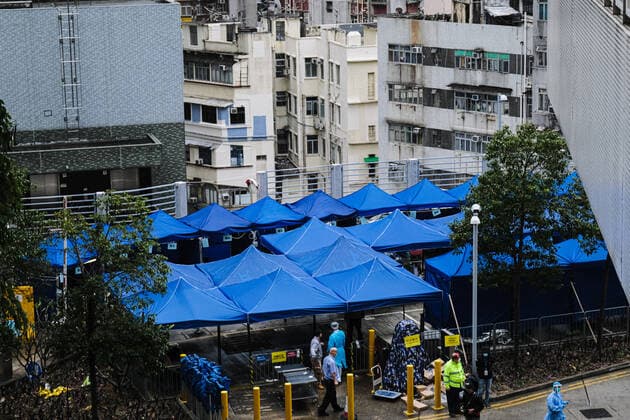 February 17, 2022, Hong Kong, China: Covid-19 patients sleep and wait at a temporary triage area outside the Caritas Medical Center hospital. As the fifth wave of Covid surges, cases worsen in Hong Kong as daily cases reaching the 5,000 mark. Hong Kong has adopted the China s Zero Covid Policy to suppress all outbreaks and by all necessary measures to get the virus under control. Hong Kong China - ZUMAt141 20220217_zap_t141_003 Copyright: xKeithxTsujix