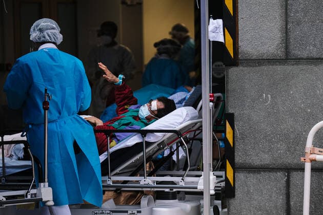 February 17, 2022, Hong Kong, China: Covid-19 patients sleep and wait at a temporary triage area outside the Caritas Medical Center hospital. As the fifth wave of Covid surges, cases worsen in Hong Kong as daily cases reaching the 5,000 mark. Hong Kong has adopted the China s Zero Covid Policy to suppress all outbreaks and by all necessary measures to get the virus under control. Hong Kong China - ZUMAt141 20220217_zap_t141_005 Copyright: xKeithxTsujix