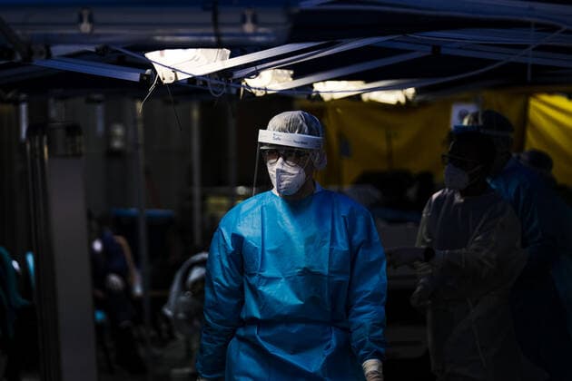 February 17, 2022, Hong Kong, China: Nurses with PPE check on Covid-19 patients at a temporary triage area outside the Caritas Medical Center hospital. As the fifth wave of Covid surges, cases worsen in Hong Kong as daily cases reaching the 5,000 mark. Hong Kong has adopted the China s Zero Covid Policy to suppress all outbreaks and by all necessary measures to get the virus under control. Hong Kong China - ZUMAt141 20220217_zap_t141_007 Copyright: xKeithxTsujix