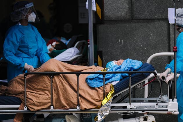 February 17, 2022, Hong Kong, China: Covid-19 patients sleep and wait at a temporary triage area outside the Caritas Medical Center hospital. As the fifth wave of Covid surges, cases worsen in Hong Kong as daily cases reaching the 5,000 mark. Hong Kong has adopted the China s Zero Covid Policy to suppress all outbreaks and by all necessary measures to get the virus under control. Hong Kong China - ZUMAt141 20220217_zap_t141_008 Copyright: xKeithxTsujix