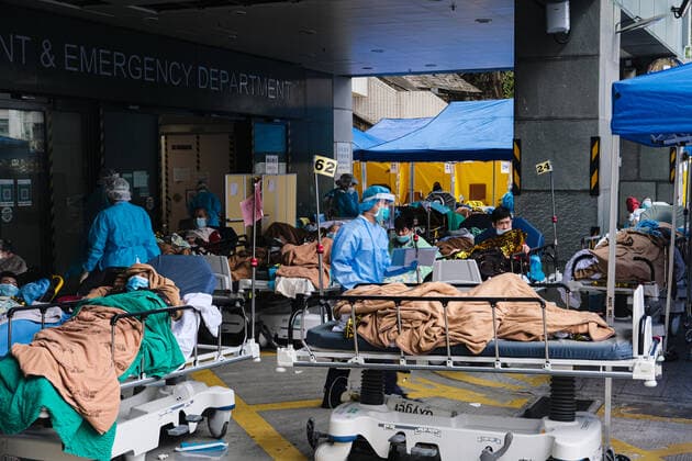 February 17, 2022, Hong Kong, China: Covid-19 patients sleep and wait at a temporary triage area outside the Caritas Medical Center hospital. As the fifth wave of Covid surges, cases worsen in Hong Kong as daily cases reaching the 5,000 mark. Hong Kong has adopted the China s Zero Covid Policy to suppress all outbreaks and by all necessary measures to get the virus under control. Hong Kong China - ZUMAt141 20220217_zap_t141_010 Copyright: xKeithxTsujix