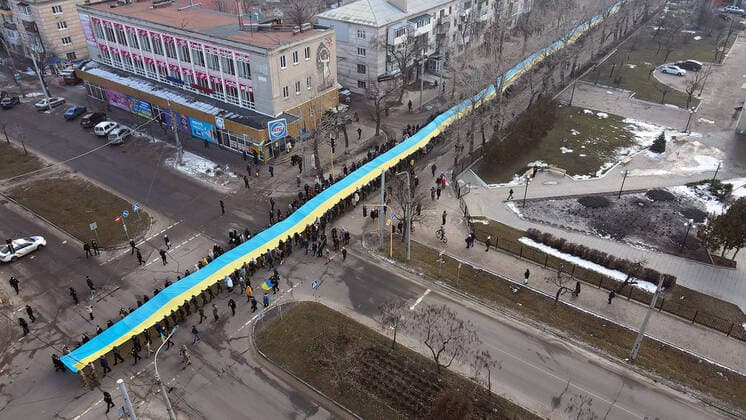 SIEVIERODONETSK, UKRAINE - FEBRUARY 16, 2022 - People carry a long Ukrainian flag in the streets in celebration of the Day of Unity, Sievierodonetsk, Luhansk Region, eastern Ukraine. Unity Day procession in Sievierodonetsk  Copyright: xOleksiixKovalovx