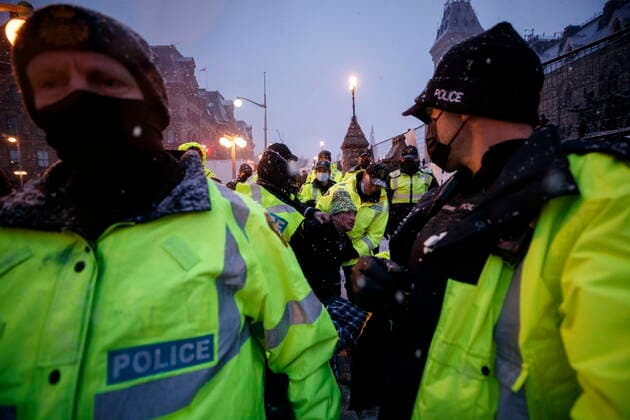 February 17, 2022, OTTAWA, ON, CANADA: A man is arrested by police as protestors and supporters gather as a protest against COVID-19 measures that has grown into a broader anti-government protest continues to occupy downtown Ottawa on Thursday, Feb. 17, 2022. OTTAWA CANADA  - ZUMAc35_ 20220217_zaf_c35_173 Copyright: xColexBurstonx