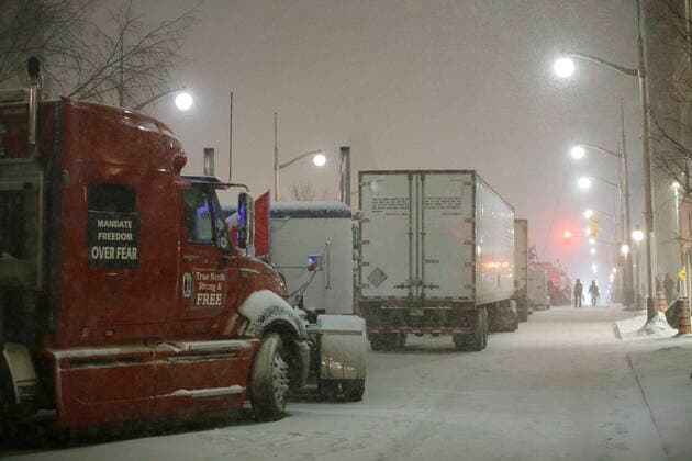 February 17, 2022, OTTAWA, ON, CANADA: Protestors and supporters walk amongst trucks as they gather during a protest against COVID-19 measures that has grown into a broader anti-government protest continues to occupy downtown Ottawa on Thursday, Feb. 17, 2022. OTTAWA CANADA  - ZUMAc35_ 20220217_zaf_c35_179 Copyright: xColexBurstonx