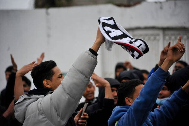 February 17, 2022, Tunis, Tunisia: Grand Tunis, Tunisia. 17 February 2022. Supporters of Football Club Africain stage a protest for the death of football fan Omar Abidi, in front of the Court of First Instance in the Tunisian city of Ben Arous. Omar Abidi, 19, drowned in a stream near the Rades Stadium in 2018, following a match between Club Africain and the Olympique Medenine teams. Abidi s family has filed a complaint against the police, with many football fans also blaming the police for he tragic death of the 19-year-old Tunis Tunisia - ZUMAd99_ 20220217_zap_d99_029 Copyright: xHasanxMradx