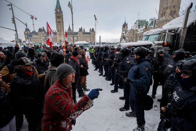 February 19, 2022, Ottawa, ON, Canada: Police move in to clear downtown Ottawa near Parliament hill of protesters after weeks of demonstrations on Saturday, Feb. 19, 2022. Police arrested scores of demonstrators and towed away vehicles Friday in Canada s besieged capital, and a stream of trucks started leaving under the pressure, raising authorities hopes for an end to the three-week protest against the country s COVID-19 restrictions. Ottawa Canada  - ZUMAc35_ 20220219_zaf_c35_060 Copyright: xColexBurstonx