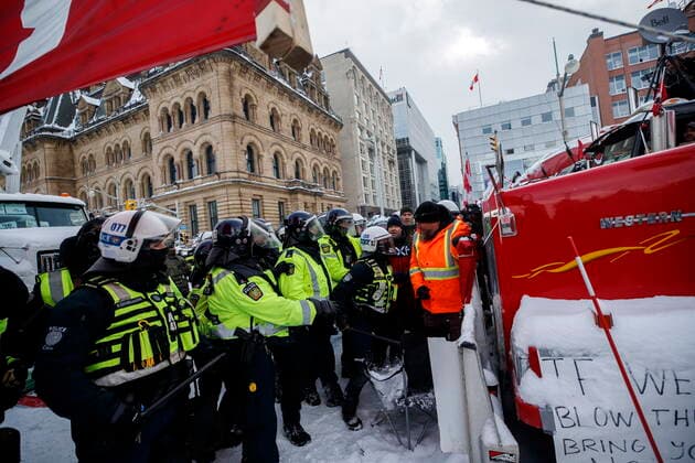 February 19, 2022, Ottawa, ON, Canada: Police move in to clear downtown Ottawa near Parliament hill of protesters after weeks of demonstrations on Saturday, Feb. 19, 2022. Police arrested scores of demonstrators and towed away vehicles Friday in Canada s besieged capital, and a stream of trucks started leaving under the pressure, raising authorities hopes for an end to the three-week protest against the country s COVID-19 restrictions. Ottawa Canada  - ZUMAc35_ 20220219_zaf_c35_062 Copyright: xColexBurstonx