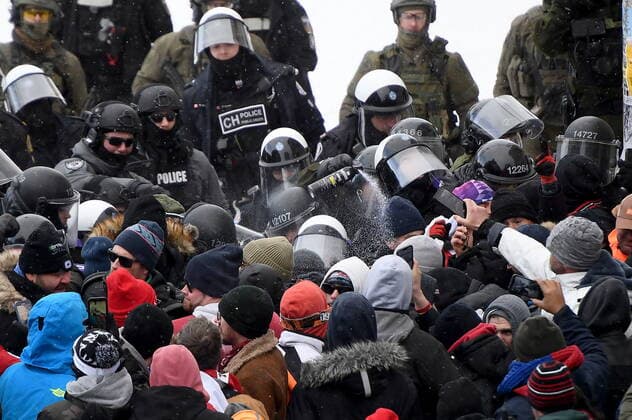 February 19, 2022, Ottawa, ON, CANADA: Police deploy a chemical riot control agent as they take action to put an end to a protest, which started in opposition to mandatory COVID-19 vaccine mandates and grew into a broader anti-government demonstration and occupation, in Ottawa, Saturday, Feb. 19, 2022. Ottawa CANADA  - ZUMAc35_ 20220219_zaf_c35_085 Copyright: xJustinxTangx