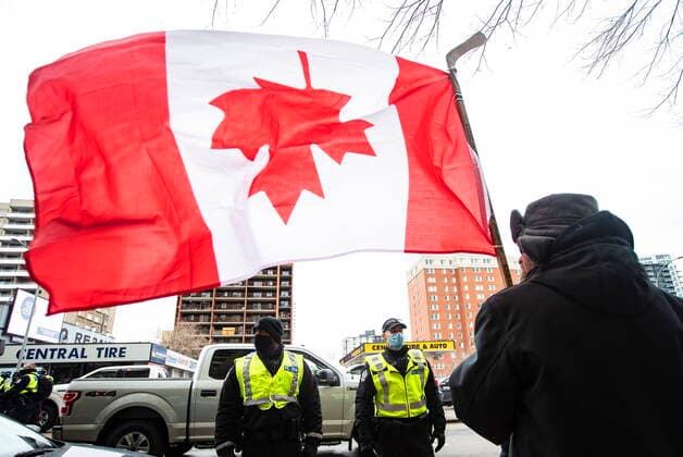 February 19, 2022, EDMONTON, AB, CANADA: Protestors confront police officers as demonstrators gathered to protest against COVID-19 measures and in support of a demonstration in Ottawa which has grown to a broader anti-government demonstration, in Edmonton, Saturday, Feb. 19, 2022. EDMONTON CANADA  - ZUMAc35_ 20220219_zaf_c35_136 Copyright: xJasonxFransonx