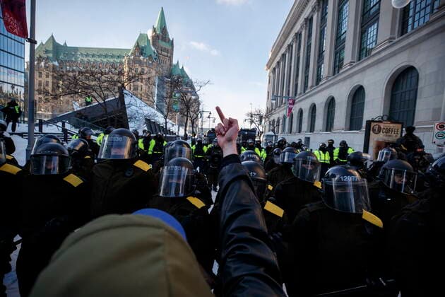 February 19, 2022, OTTAWA, ON, CANADA: Police push back protestors as authorities take action to end a protest against COVID-19 measures that has grown into a broader anti-government protest and occupation, in Ottawa, Saturday, Feb. 19, 2022. OTTAWA CANADA  - ZUMAc35_ 20220219_zaf_c35_205 Copyright: xColexBurstonx