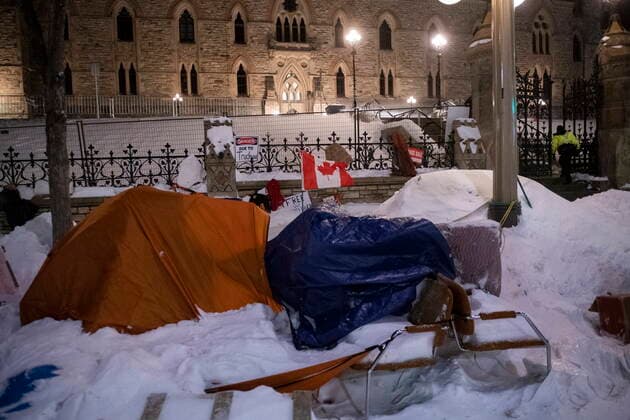February 19, 2022, Ottawa, ON, Canada: A tent, chairs and other debris lay on the ground in front of Parliament Hill™s West Block after police took action to clear the street of trucks and protesters to end a protest, which started in opposition to mandatory COVID-19 vaccine mandates and grew into a broader anti-government demonstration and occupation, on its 23rd day, in Ottawa, Saturday, Feb. 19, 2022. Ottawa Canada  - ZUMAc35_ 20220219_zaf_c35_240 Copyright: xJustinxTangx