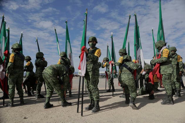 109th Anniversary Of The Mexican Army Members of the army hold Mexican flags during the commemoration of the 109th Anniversary of the Mexican Army in Ramos Arizpe, Coahuila. The past that shaped this armed force and laid the foundations for what it is today dates back to the Mexican Revolution, with the enactment of Decree 1421 on 19 February 1913, issued by the XXII Congress of the State of Coahuila, by which the government of Victoriano Huerta was disowned, empowering Governor Venustiano Carranza to arm forces and restore constitutional order. Ramos Arizpe Coahuila Ramos Arizpe Coahuila Mexico  Copyright: xGerardoxVieyrax originalFilename: vieyra-notitle220219_npmXJ.jpg