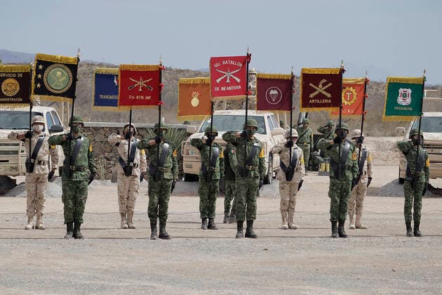 109th Anniversary Of The Mexican Army Members of the army hold banners during the commemoration of the 109th Anniversary of the Mexican Army in Ramos Arizpe, Coahuila. The past that shaped this armed force and laid the foundations for what it is today dates back to the Mexican Revolution, with the enactment of Decree 1421 on 19 February 1913, issued by the XXII Congress of the State of Coahuila, by which the government of Victoriano Huerta was disowned, empowering Governor Venustiano Carranza to arm forces and restore constitutional order. Ramos Arizpe Coahuila Ramos Arizpe Coahuila Mexico  Copyright: xGerardoxVieyrax originalFilename: vieyra-notitle220219_npTLr.jpg