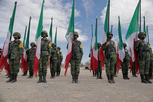 109th Anniversary Of The Mexican Army Members of the army hold Mexican flags during the commemoration of the 109th Anniversary of the Mexican Army in Ramos Arizpe, Coahuila. The past that shaped this armed force and laid the foundations for what it is today dates back to the Mexican Revolution, with the enactment of Decree 1421 on 19 February 1913, issued by the XXII Congress of the State of Coahuila, by which the government of Victoriano Huerta was disowned, empowering Governor Venustiano Carranza to arm forces and restore constitutional order. Ramos Arizpe Coahuila Ramos Arizpe Coahuila Mexico  Copyright: xGerardoxVieyrax originalFilename: vieyra-notitle220219_npVIu.jpg