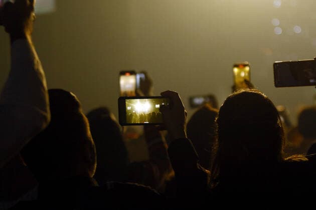 February 19, 2022, Valencia, Carabobo, Venezuela: February 19, 2022. fans make video with their cell phones of Miguel Ignacio Mendoza Donatti, better known as Nacho . Venezuelan singer, during a concert in the Hotel Hesperia, from Valencia, Carabobo state. Photo: Valencia Venezuela - ZUMAhe3_ 20220219_zbp_he3_009 Copyright: xJuanxCarlosxHernandezx