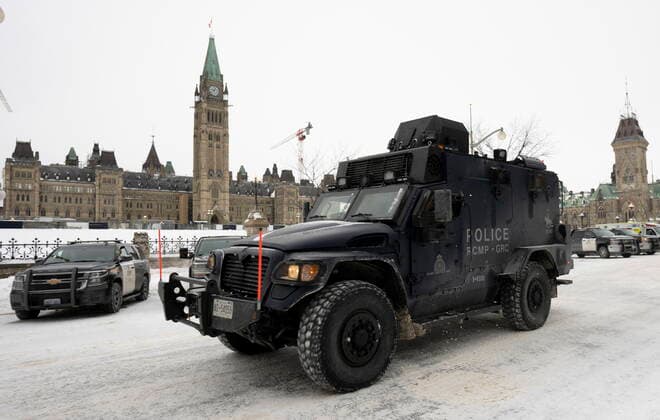 February 20, 2022, Ottawa, ON, Canada: An RCMP tactical vehicle drives past the Parliament buildings, Sunday, Feb. 20, 2022 in Ottawa. Ottawa Canada  - ZUMAc35_ 20220220_zaf_c35_039 Copyright: xAdrianxWyldx