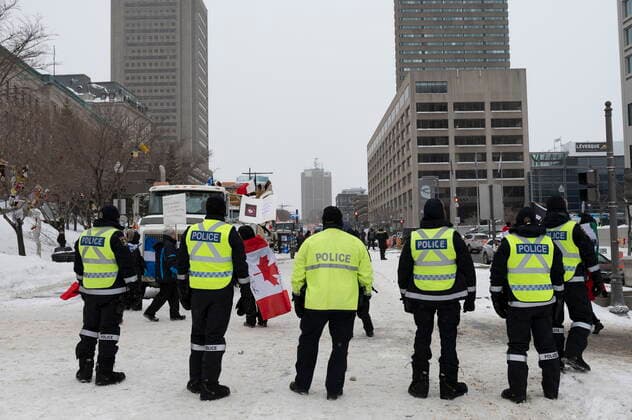 February 20, 2022, QUEBEC, PQ, Canada: Police officers guard the street as hundreds of people demonstrate against COVID-19 measures Sunday, February 20, 2022 in front of the legislature in Quebec City. QUEBEC Canada  - ZUMAc35_ 20220220_zaf_c35_072 Copyright: xJacquesxBoissinotx