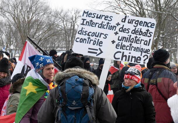 February 20, 2022, QUEBEC, PQ, Canada: People carry anti anti-electronic measures sign as hundreds of people demonstrate against COVID-19 measures Sunday, February 20, 2022 in front of the legislature in Quebec City. QUEBEC Canada  - ZUMAc35_ 20220220_zaf_c35_077 Copyright: xJacquesxBoissinotx