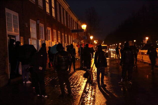 Counter demonstrators stand in Gutenbergstraße during a demonstration against compulsory vaccination in the coronavirus pandemic, Potsdam, Germany, Feb. 21, 2022 Demo against compulsory vaccination