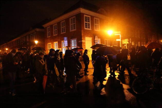 Demonstrators walk in Gutenbergstraße during a demonstration against compulsory vaccination in the coronavirus pandemic, Potsdam, Germany, February 21, 2022 Demo against compulsory vaccination