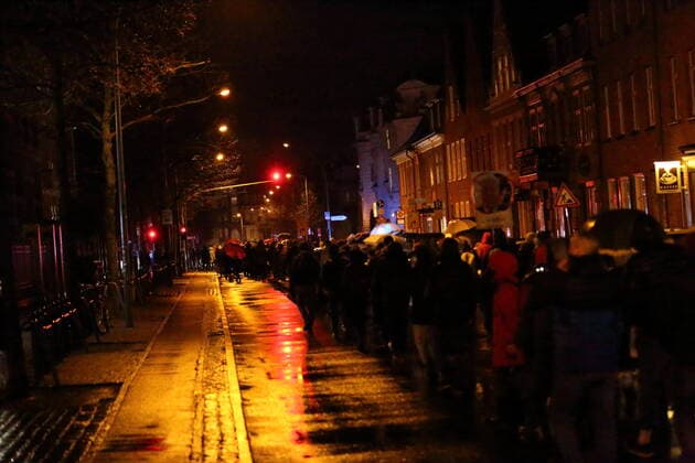 Protesters walk in Kurfürstenstraße during a demonstration against compulsory vaccination in the coronavirus pandemic, Potsdam, 21 February 2022 Demo against compulsory vaccination