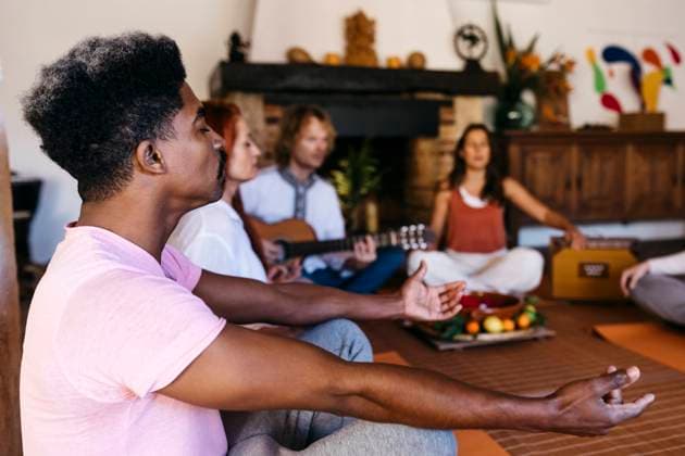Man meditating at music therapy in farmhouse model released property released, JRFF05294
