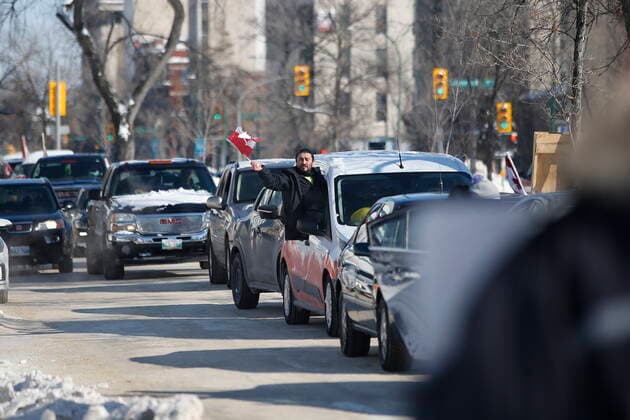February 23, 2022, WINNIPEG, MANITOBA, CANADA: A convoy of COVID-19 mandate protesters heads home Wednesday, February 23, 2022. The group received a notice from the Winnipeg Police that they have a deadline of 5pm Wednesday to move off the street and unblock Memorial Blvd. The group plans to depart peacefully and set up a camp in a nearby park. WINNIPEG CANADA  - ZUMAc35_ 20220223_zaf_c35_078 Copyright: xJohnxWoodsx