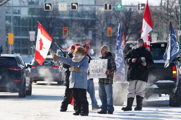 February 23, 2022, WINNIPEG, MANITOBA, CANADA: A small group of COVID-19 mandate protesters remain on the street as the group packs up and prepares to head home Wednesday, February 23, 2022. The group received a notice from the Winnipeg Police that they have a deadline of 5pm Wednesday to move off the street and unblock Memorial Blvd. The group plans to depart peacefully and set up a camp in a nearby park. WINNIPEG CANADA  - ZUMAc35_ 20220223_zaf_c35_096 Copyright: xJohnxWoodsx