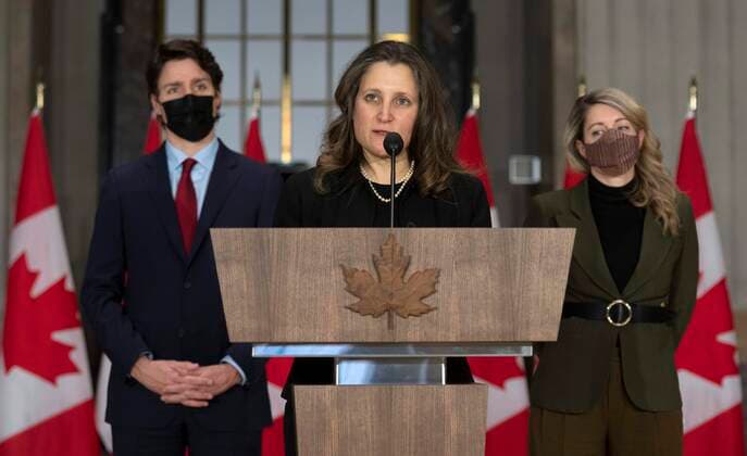 February 24, 2022, Ottawa, ON, Canada: Canadian Prime Minister Justin Trudeau and Foreign Affairs Minister Melanie Joly listen as Deputy Prime Minister and Finance Minister Chrystia Freeland speaks during a news conference, Thursday, Feb. 24, 2022 in Ottawa. Ottawa Canada  - ZUMAc35_ 20220224_zaf_c35_019 Copyright: xAdrianxWyldx