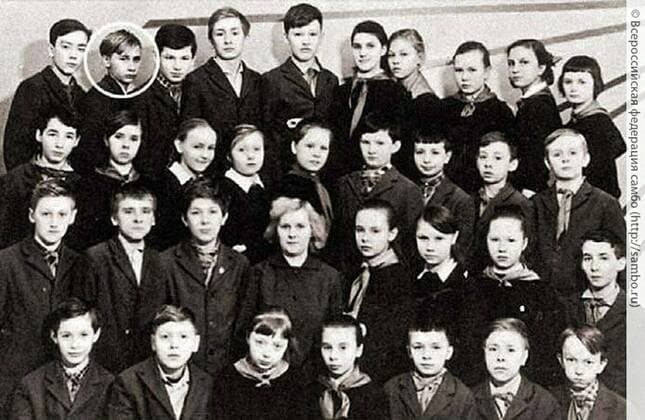 Before rising to power as one of the most infamous leaders in the world, Putin was a playful, hipster-dressing man in love. circa 1964, Russia: VLADIMIR PUTIN in childhood (top row, 2nd left). St. Petersburg Russia - ZUMAz03_ 19640101_smk_z03_755 Copyright: xRussianxArchivesx