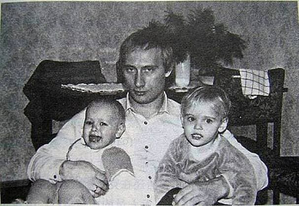 Before rising to power as one of the most infamous leaders in the world, Putin was a playful, hipster-dressing man in love. circa 1989, Russia: A young VLADIMIR PUTIN with his daughters. St. Petersburg Russia - ZUMAz03_ 19890202_smk_z03_759 Copyright: xRussianxArchivesx