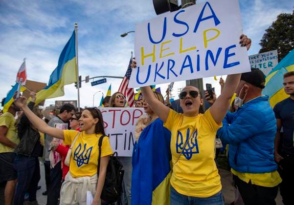 February 27, 2022, Los Angeles, California, USA: Kristina Vasiliev (right) holds a sign saying USA Help Ukraine. She was among the hundreds of people from the Ukrainian American community in Los Angeles and their supporters who gathered at the intersection of Santa Monica and Sepulveda Boulevards in Westwood to protest against Russia s invasion of Ukraine. Los Angeles USA - ZUMAc18_ 20220227_znp_c18_017 Copyright: xJillxConnellyx