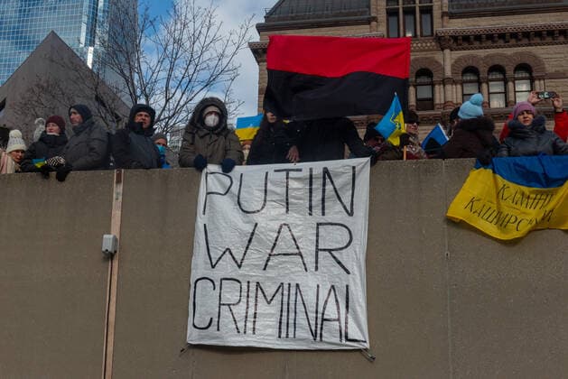Stand With Ukraine Mega March To Support Ukraine Following Russia™s Invasion Demonstrators with yellow and blue Ukraine flags and anti-war signs in Downtown Nathan Phillips Square during a demonstration against Russian invasion in Ukraine. Toronto Ontario Canada  Copyright: xAnatoliyxCherkasovx originalFilename: cherkasov-standwit220227_npR3q.jpg