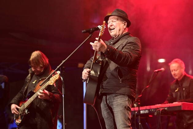 The Olympic band, from left Milan Broum, frontman Petr Janda and Pavel Brezina, perform during a benefit concert for Ukraine, which took place on Wenceslas Square in Prague, Czech Republic, on Tuesday, March 1st, 2022. (CTKxPhoto RomanxVondrous) CTKPhotoP2022030110992 