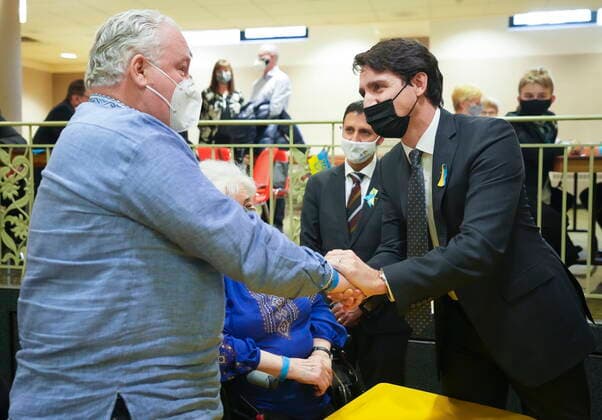 March 4, 2022, TORONTO, ON, CANADA: Canadian Prime Minister Justin Trudeau, right, greets Peter Dowhal, left, along with others from the Ukrainian community as Russia has launched a devastating attack and war on Ukraine in Toronto on Friday, March 4, 2022. TORONTO CANADA - ZUMAc35_ 20220304_zaf_c35_032 Copyright: xNathanxDenettex