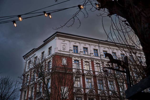 Prenzlauer Berg Germany, Berlin, 26 02 2022, house in Sredzkistraße corner Kollwitzstraße, horse symbol, chain of lights, Â