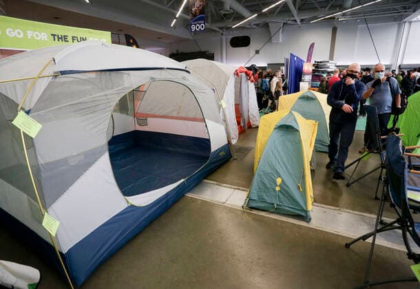 (220305) -- VANCOUVER, March 5, 2022 -- People look at camping tents at the Vancouver Outdoor Adventure and Travel Show in Vancouver, British Columbia, Canada, on March 5, 2022. The two-day event, which runs on March 5th and 6th, features the latest outdoor gear and information of adventure travel ideas. (Photo by Xinhua) CANADA-VANCOUVER-OUTDOOR ADVENTURE AND TRAVEL SHOW LiangxSen 