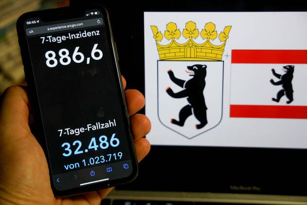 Coronavirus in Germany Covid 19 Dashboard of the Robert Koch Institute DEU, Germany, Berlin 06 03 2022 The 7-day incidence for the state Cases last 7 days 100 000 p.e. is displayed on an iPhone, with the states coat of arms in the background