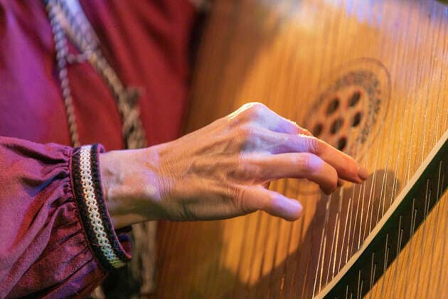 People show support for Ukraine at live music fundraiser Vera Tymshyshyn performing on the traditional Ukrainian instrument, the bandura, at the Ukrainian Refugee Fundraiser at the Brudenell Social Club, Leeds, UK Leeds Brudenell Social Club West Yorkshire United Kingdom Copyright: xIamxBurn NewsxImagesx